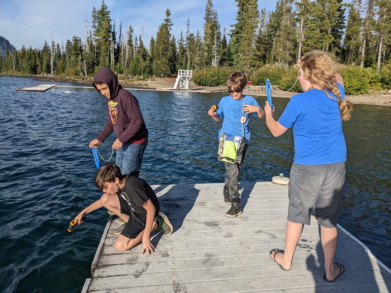 students taking lake temperature