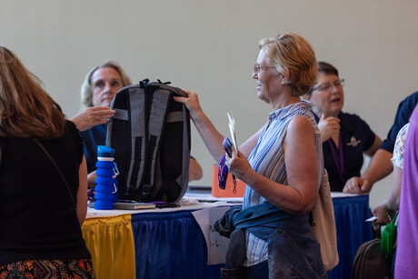 Educators check-in and collect items from their union registration tables at the 2023 North American Division Educators' Convention in Phoenix, Arizona.